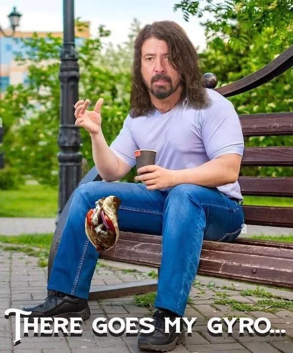 A visual pun and meme dump entry showing Dave Grohl watching a sandwich fall, captioned with the lyric parody There goes my gyro.