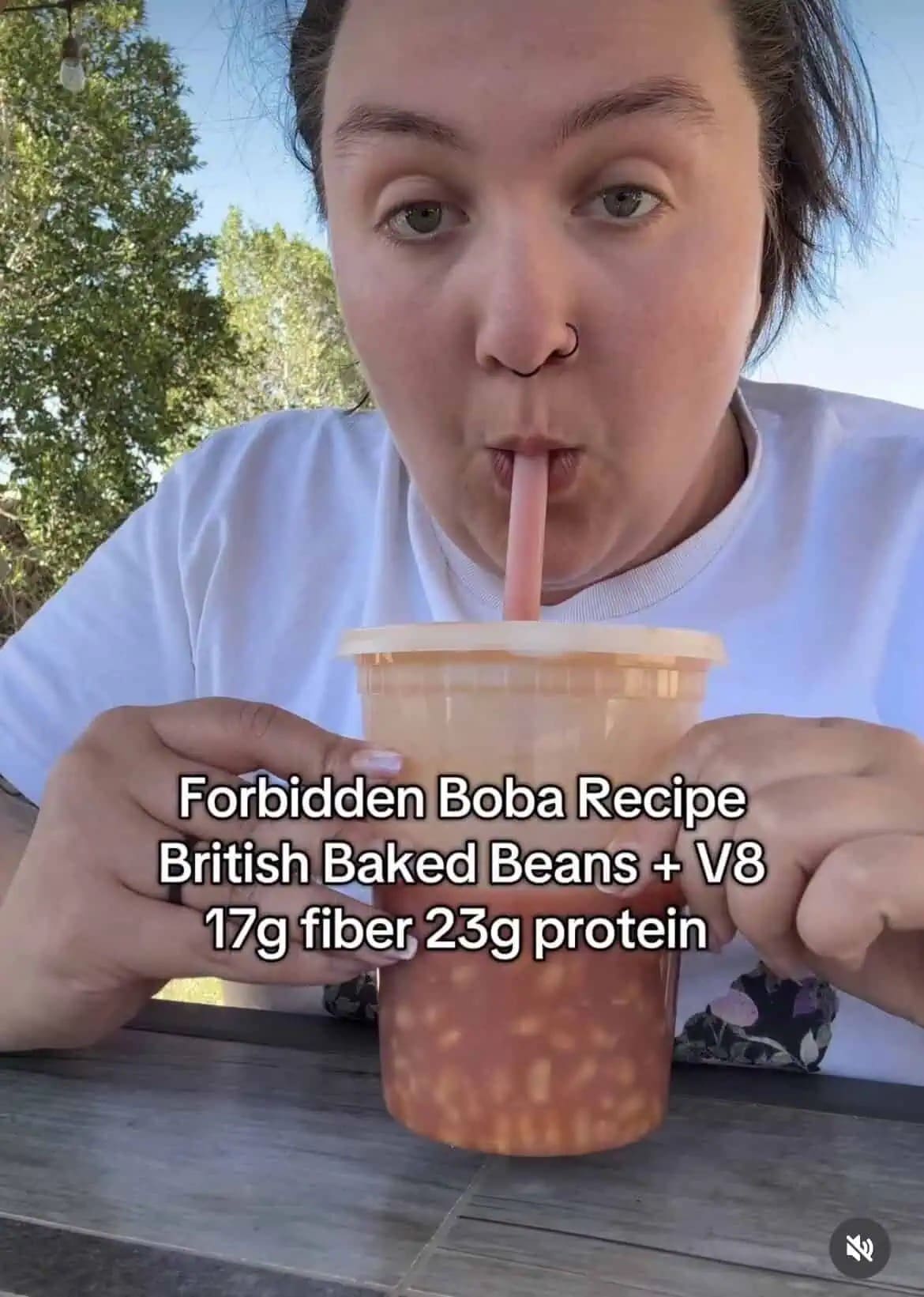 A deeply cursed food funny meme from this meme dump showing a person drinking a custom beverage called the "Forbidden Boba Recipe" made entirely of British Baked Beans mixed with V8 juice.