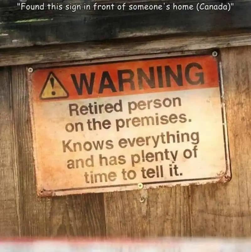 A highly relatable neighborhood funny meme showing a humorous warning sign on a wooden fence that alerts visitors of a retired person on the premises who knows absolutely everything and has plenty of time to tell you about it, a wholesome meme dump gem.