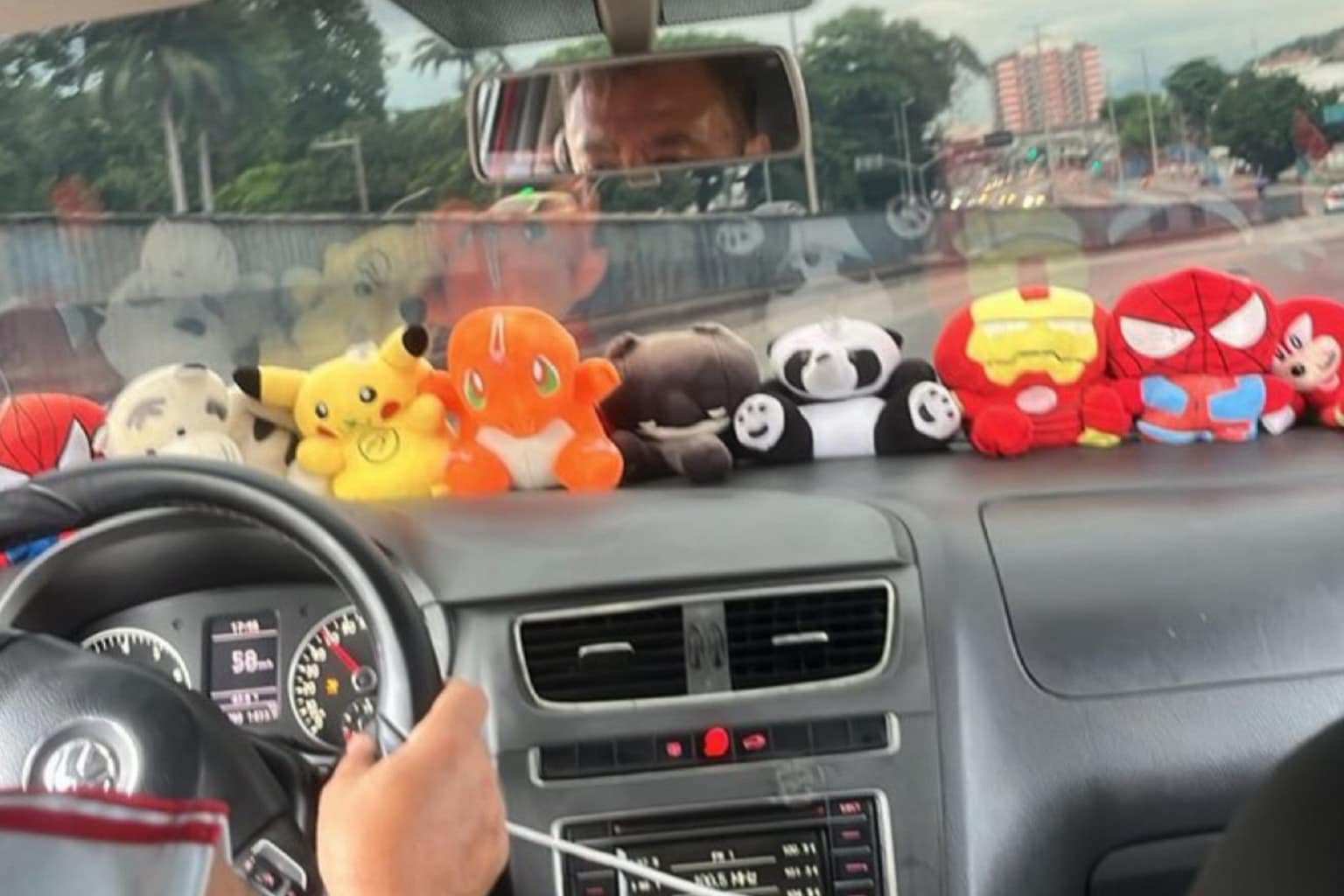 Meme dump compilation: A collage featuring a Dragon Con cosplayer dressed as Smudge the cat, an awkward tubular yellow chair, and Pokemon plushies completely blocking an Uber driver's view.