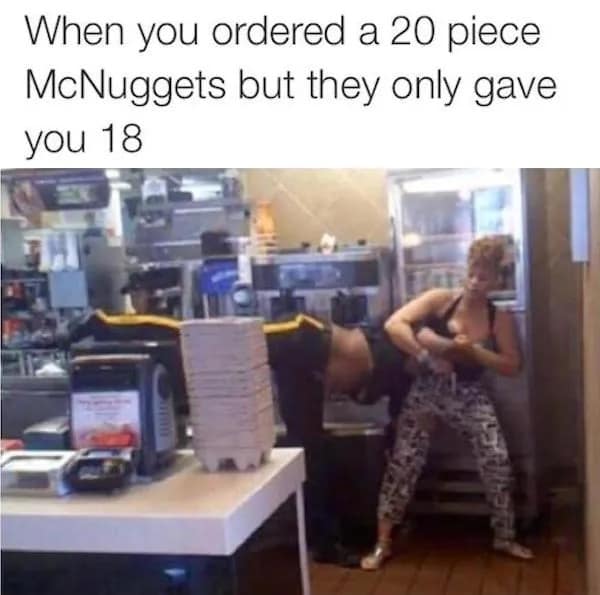 A wild funny meme depicting two fast food employees physically fighting behind the counter, captioned as the reaction "When you ordered a 20 piece McNuggets but they only gave you 18."