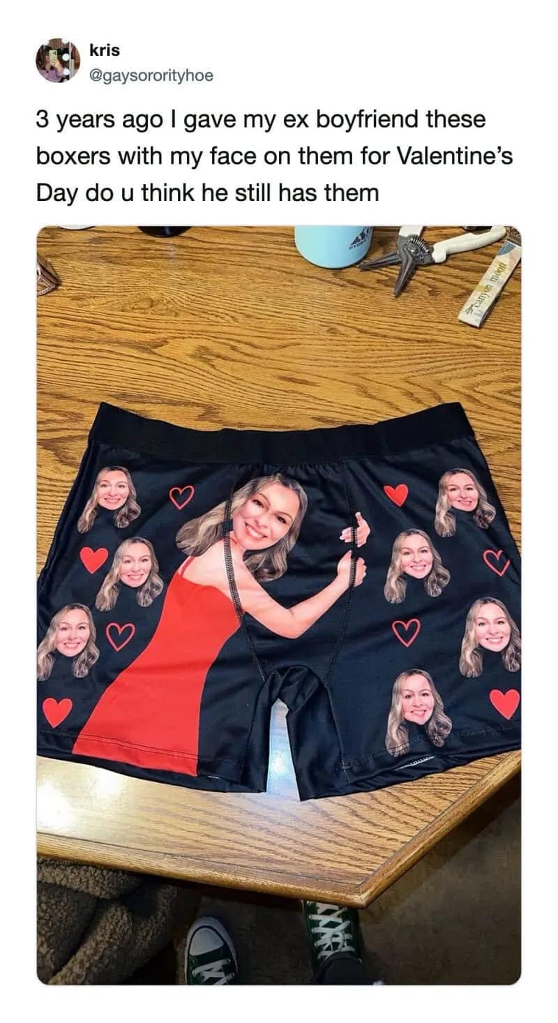 An unhinged Valentine's Day meme dump showing a custom pair of black boxer briefs densely covered in a woman's face, featuring a large cutout of her pointing finger-guns directly at the crotch area.