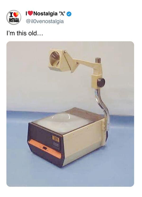 A school days nostalgia meme featuring a vintage 3M overhead projector, universally recognized by anyone who attended class before digital smartboards existed.