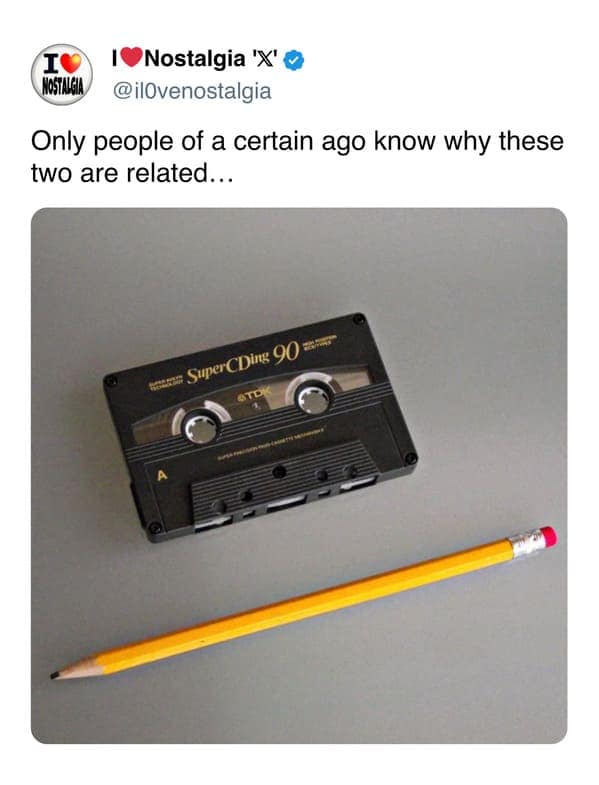 A clever nostalgic photo displaying a TDK cassette tape right next to a standard yellow pencil, highlighting the iconic trick used to manually rewind unspooled tape ribbon.