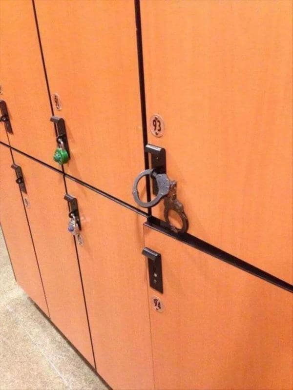 A redneck ingenuity security solution using a pair of handcuffs to lock two locker handles together instead of a padlock.