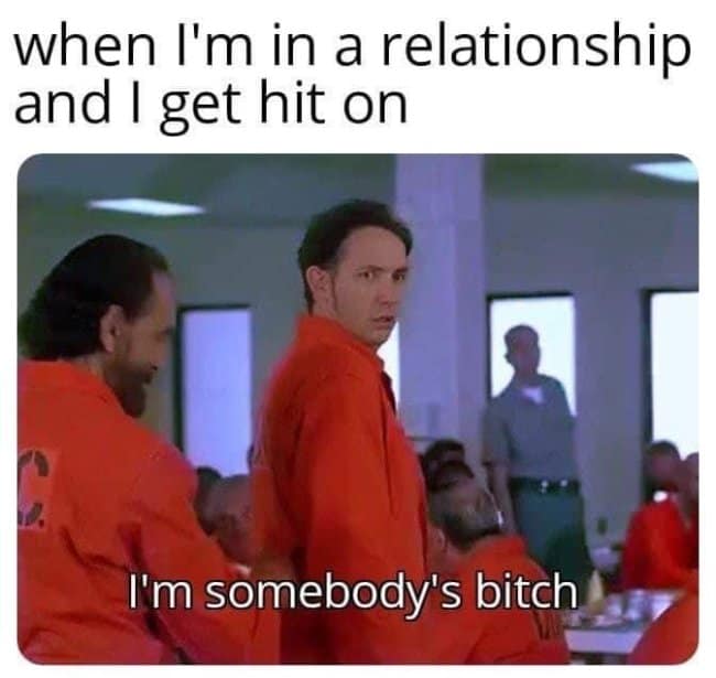 A relationship meme featuring Rob Schneider in a prison jumpsuit, joking about loyalty and submission in a relationship with the caption "I'm somebody's bi*ch."