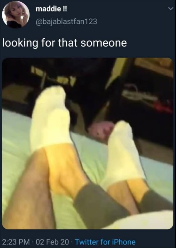 A chaotic relationship meme featuring a pair of feet on a bed with a blurry hamster in the background, captioned "looking for that someone" in a strange courtship display.
