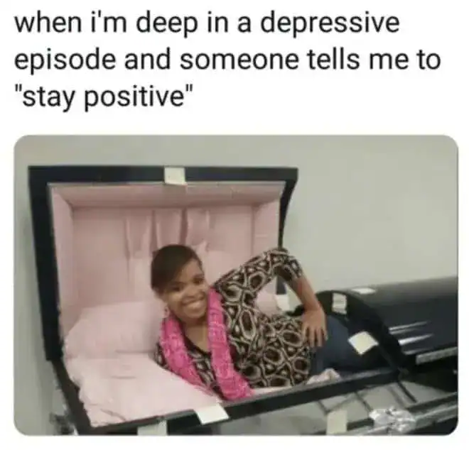 Meme showing a woman smiling in a pink-lined coffin when told to stay positive during depression.