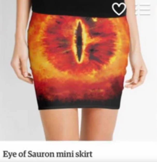 A hilarious unfortunate design showing a mini skirt printed with the flaming "Eye of Sauron," but the placement of the vertical slit pupil right on the crotch makes the garment look incredibly accidentally nsfw.