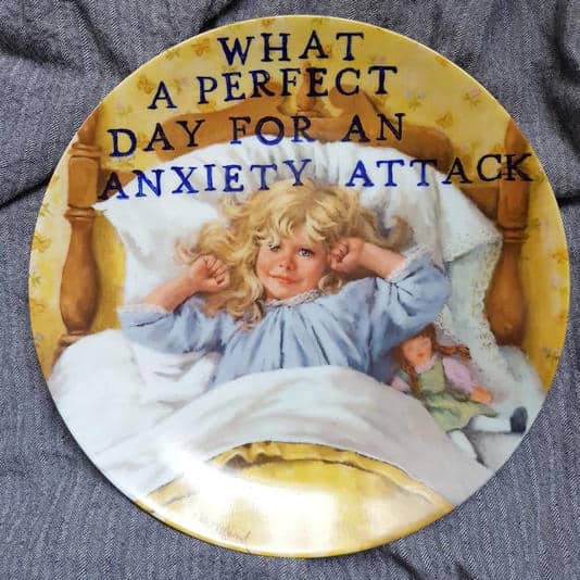 Plate of a child waking up in bed with text calling it a perfect day for anxiety.