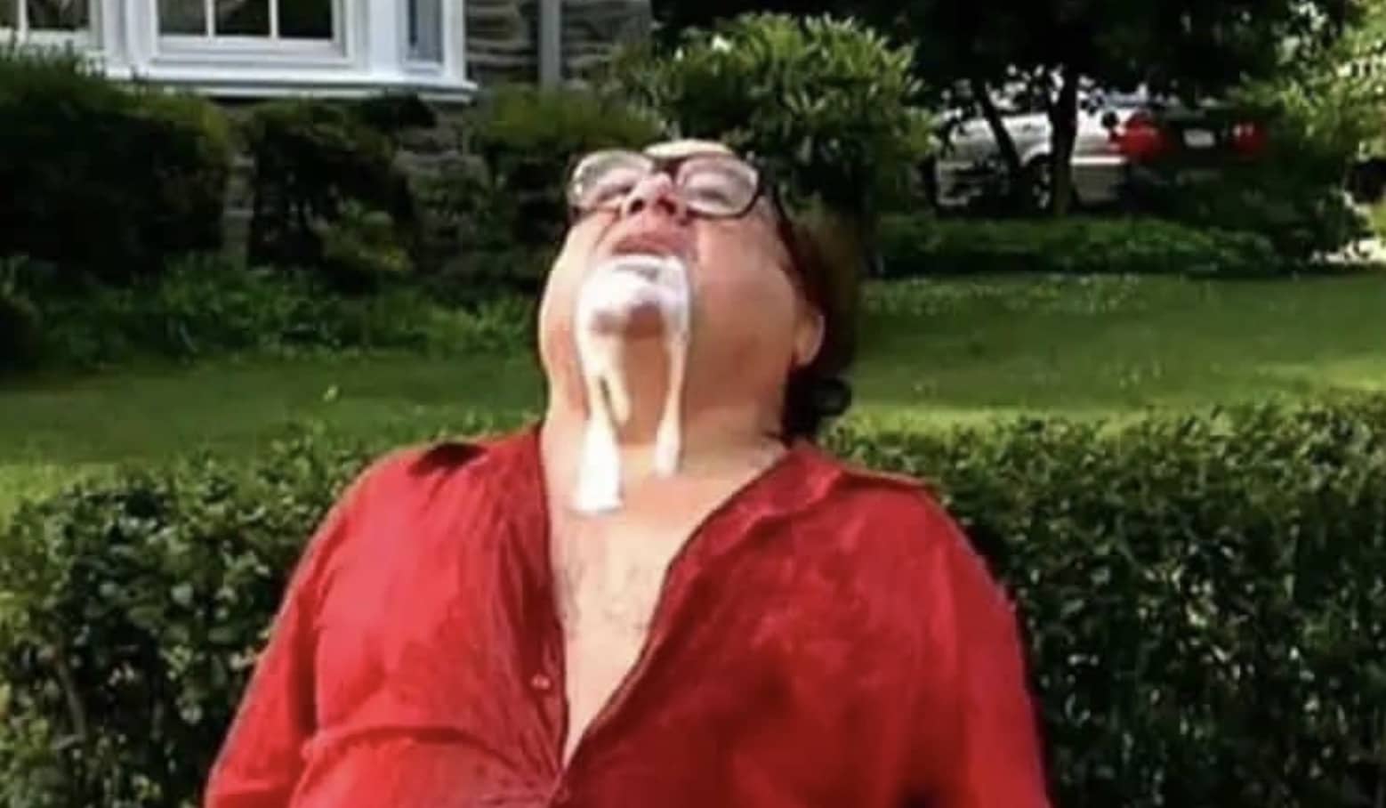 Man in red shirt with white foam pouring from mouth in classic viral reaction meme