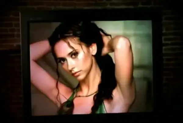 nostalgic television screenshot in these 90s pictures showing Jennifer Love Hewitt staring intensely into the camera while wearing a green top in the music video for "How Do I Deal".