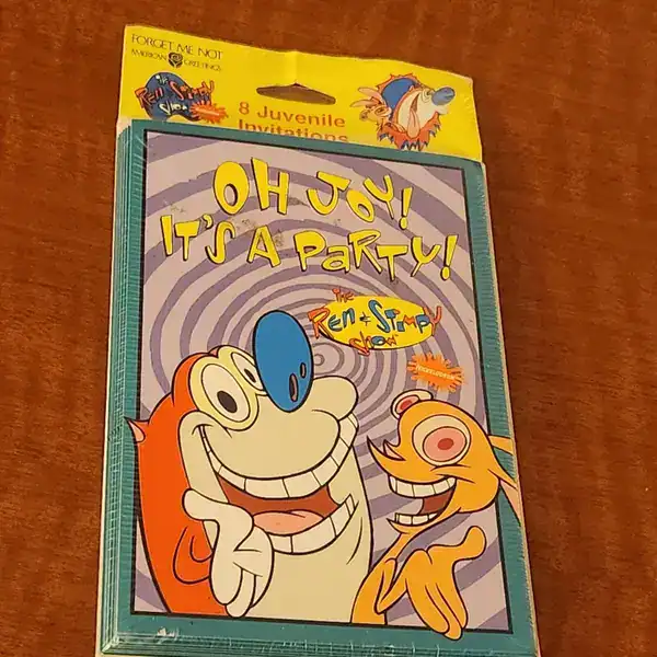 classic birthday party item in 90s pictures showing a sealed pack of eight juvenile invitations featuring a bright yellow and blue design with the manic faces of Ren and Stimpy.
