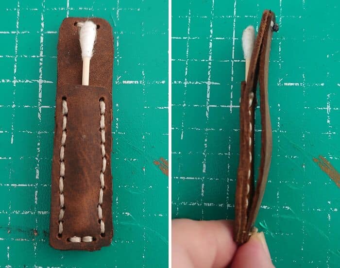 A meticulously hand-stitched thick leather sheath designed to securely hold a single cotton swab. A completely useless but well-executed diy fail.