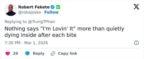 A brutal McDonalds CEO burger meme showcasing a tweet that hilariously contrasts the famous "I'm Lovin' It" slogan with the executive looking like he is quietly dying inside after each bite.