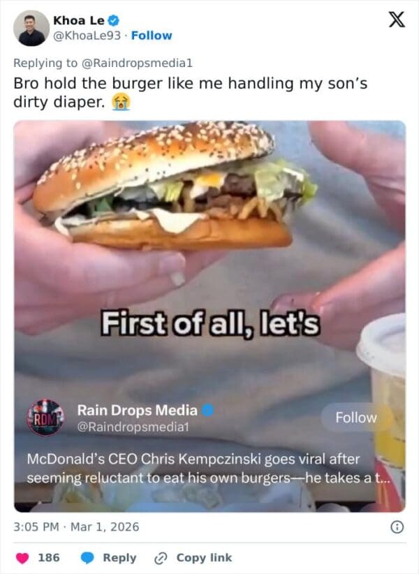 A funny McDonalds CEO burger meme highlighting a tweet that ruthlessly roasts the executive for gingerly holding the massive sandwich using only his fingertips, violently comparing it to a dad handling a dirty diaper.