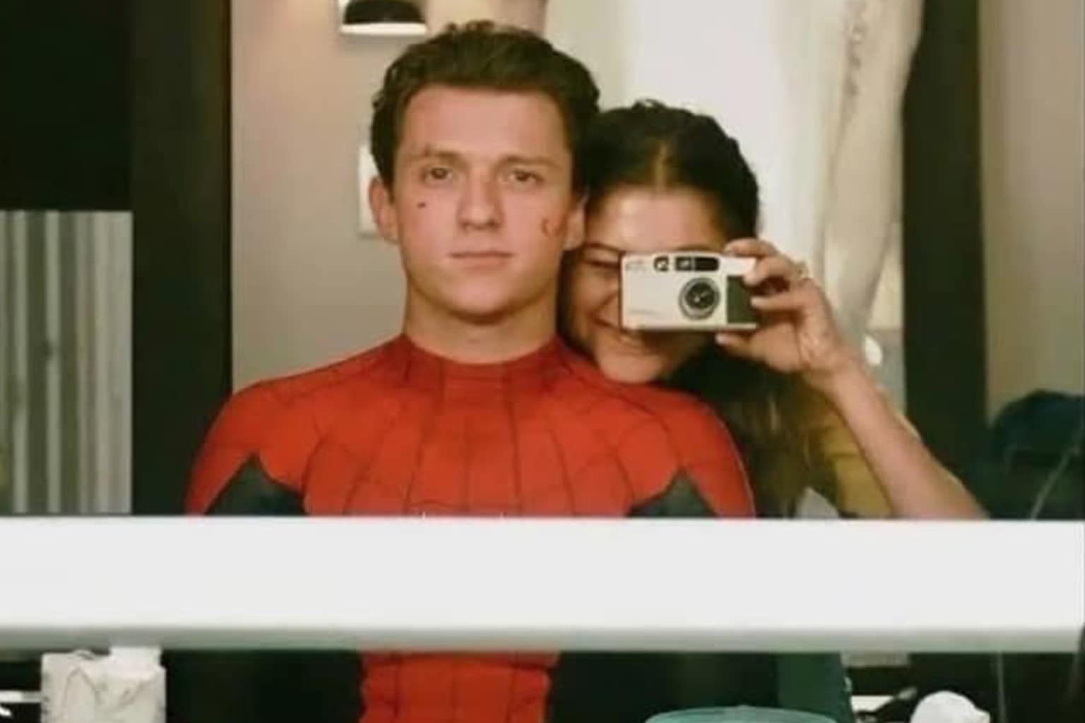 Zendaya and Tom Holland memes compilation: A collage featuring Tom passionately arguing in his Spider-Man suit, Tom flawlessly performing in the Lip Sync Battle, and the couple hilariously demonstrating a botched stunt landing on a talk show.