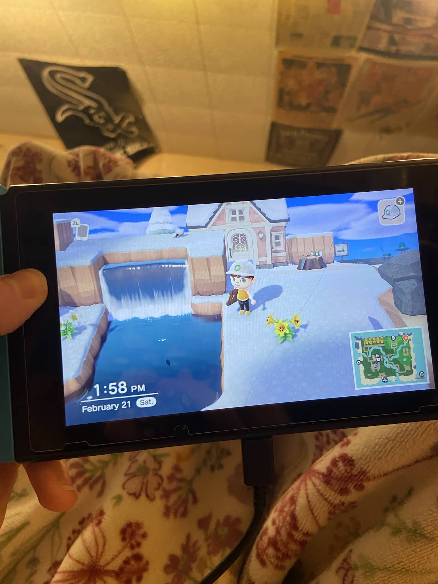 Nintendo Switch screen displaying a snowy Animal Crossing island landscape during the terraforming process.