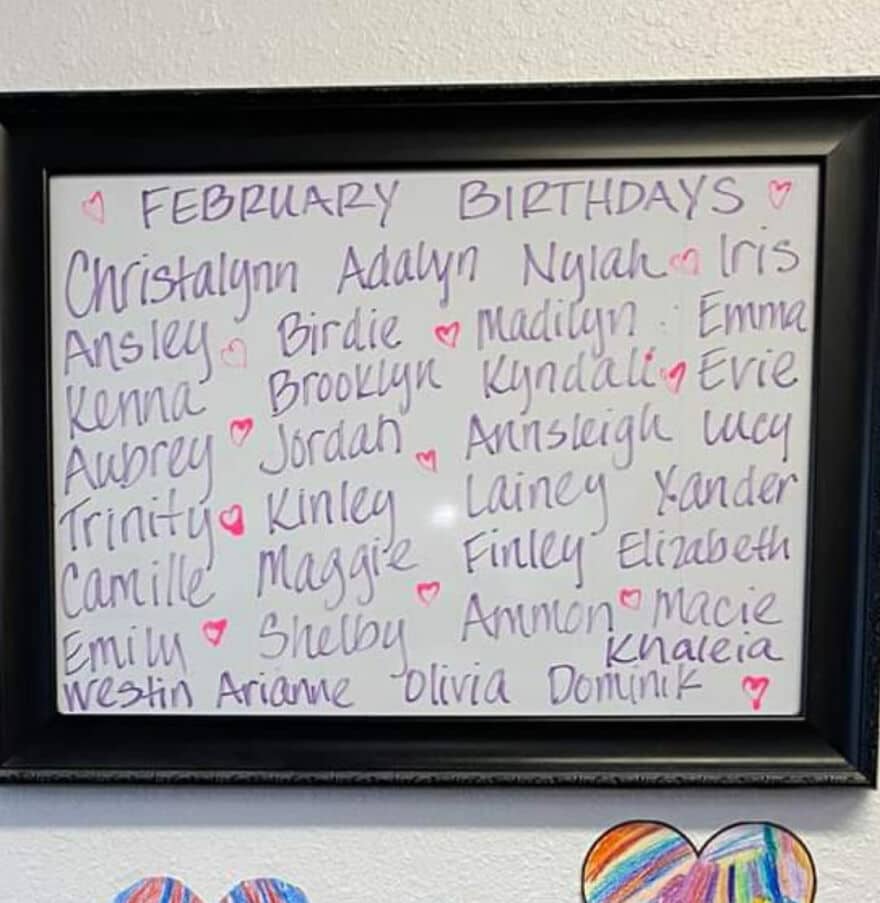 A whiteboard listing February Birthdays with unique names like Christalynn, Birdie, Annsleigh, and Khaleia.
