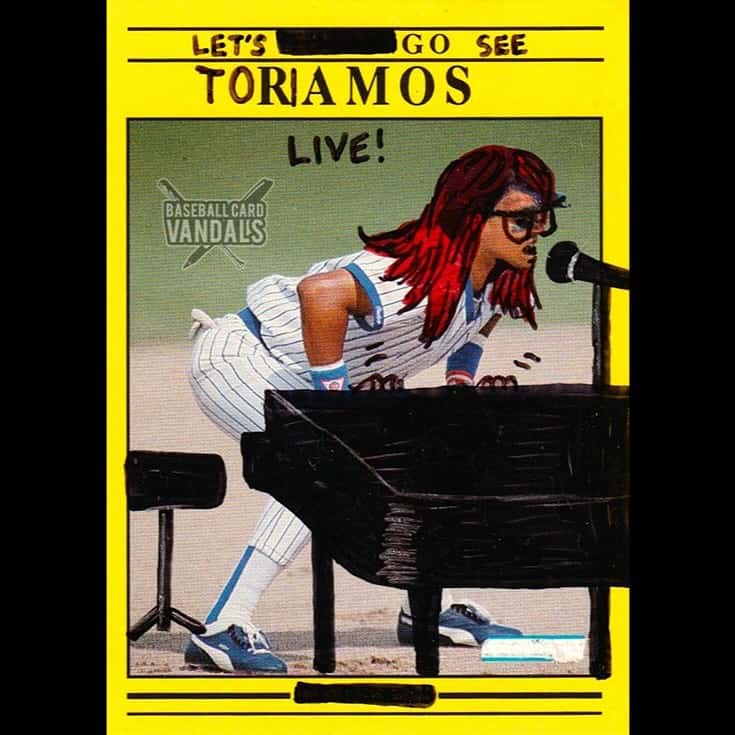 Creative baseball card modification showing a player as Tori Amos performing live at a piano.