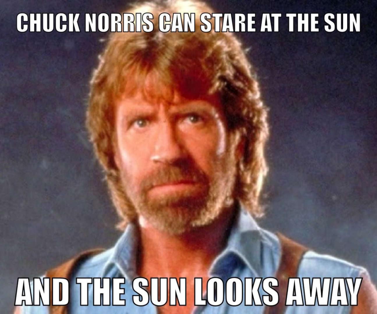 A classic portrait of a bearded, intense Chuck Norris. The bold white text claims he can stare directly at the sun until the sun is forced to look away in a display of ultimate dominance.