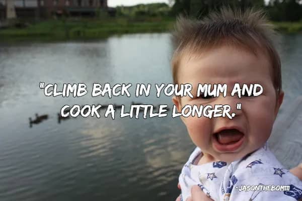 Crying baby in front of a lake with a humorous quote suggesting they need more time cooking.
