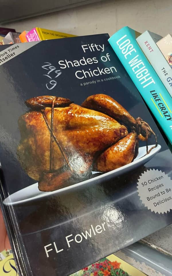 A cookbook titled Fifty Shades of Chicken featuring a roasted chicken tied up with twine.