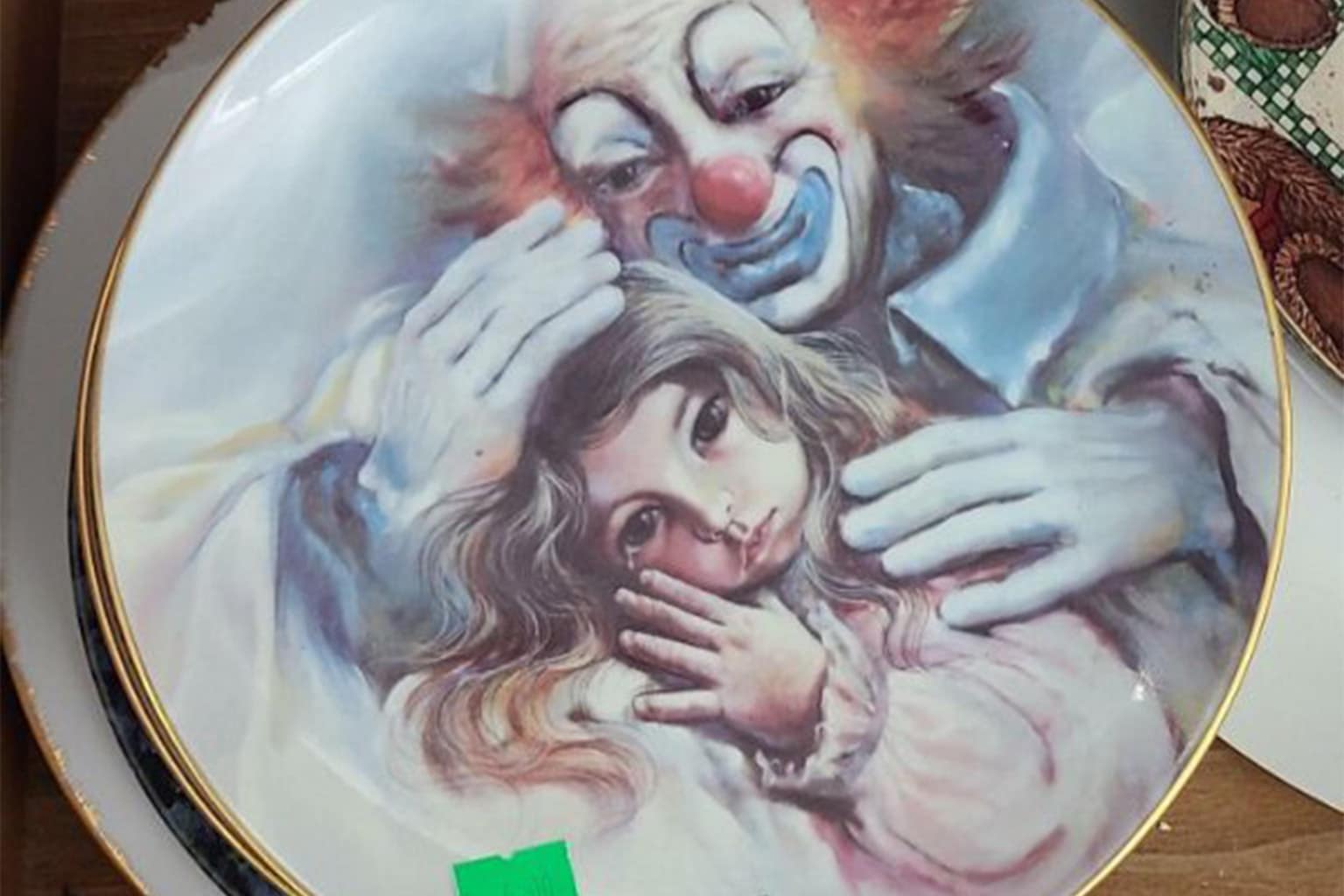 a gallery of the best thrift store finds featuring a bootleg "Sexy Mr. Cabbage Doll" that comes out of the closet, a black t-shirt rebranding a famous pizza chain as a "Mechanical Rat Child Casino," and a DIY wooden Doughboy clock with realistic eyes and bright red lipstick.