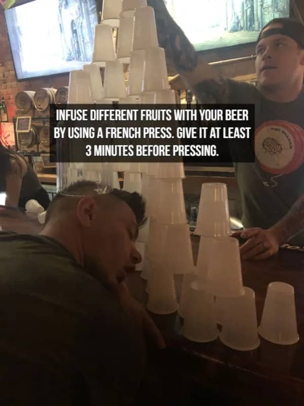 Man sleeping at a bar with cups stacked on him and text about beer infusions.
