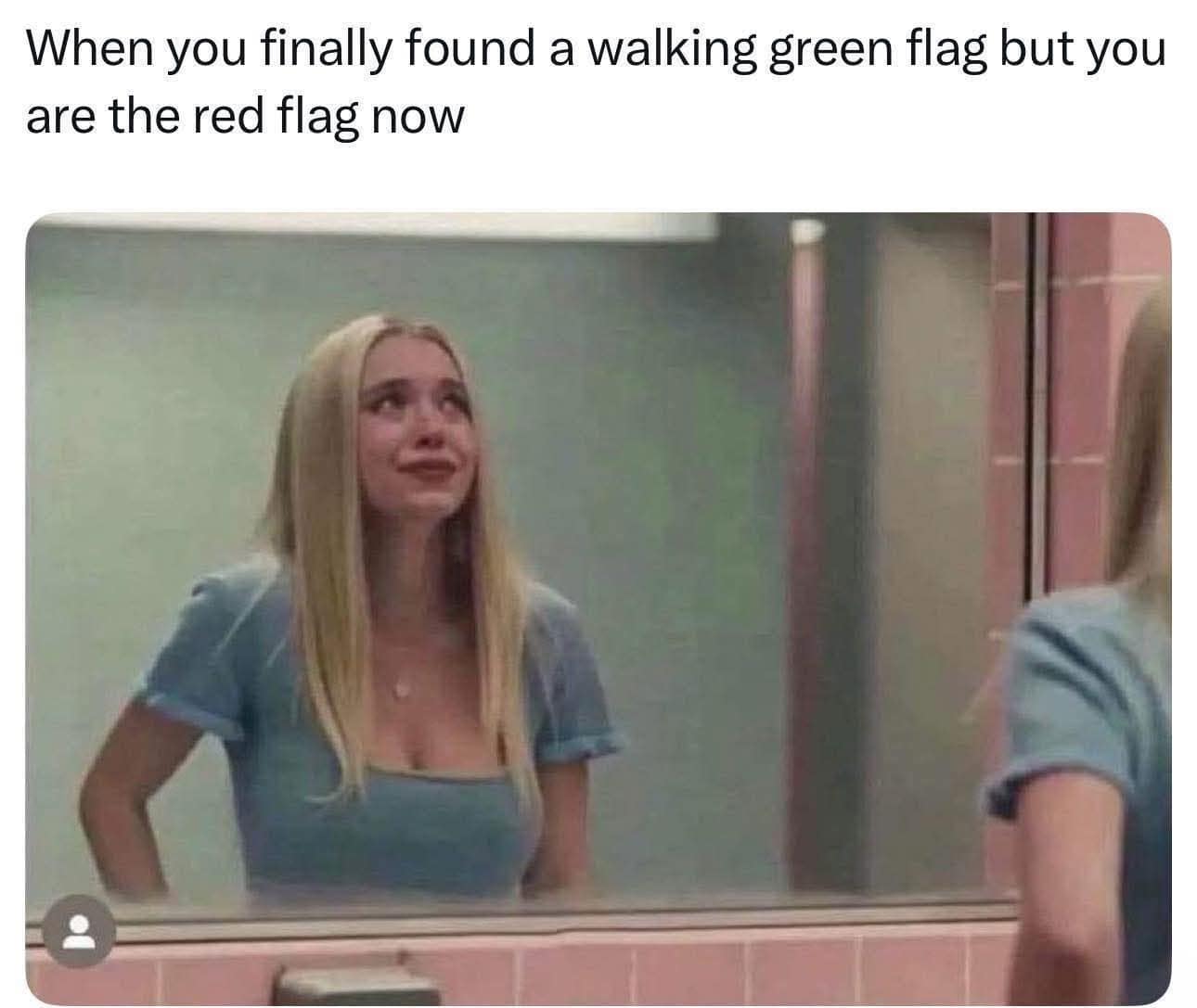 relatable classic meme showing Sydney Sweeney smiling through tears in a bathroom mirror, perfectly capturing the tragic realization that you finally found a walking green flag partner, but you are actually the red flag in the relationship, making for a timeless entry in the vault of old memes.