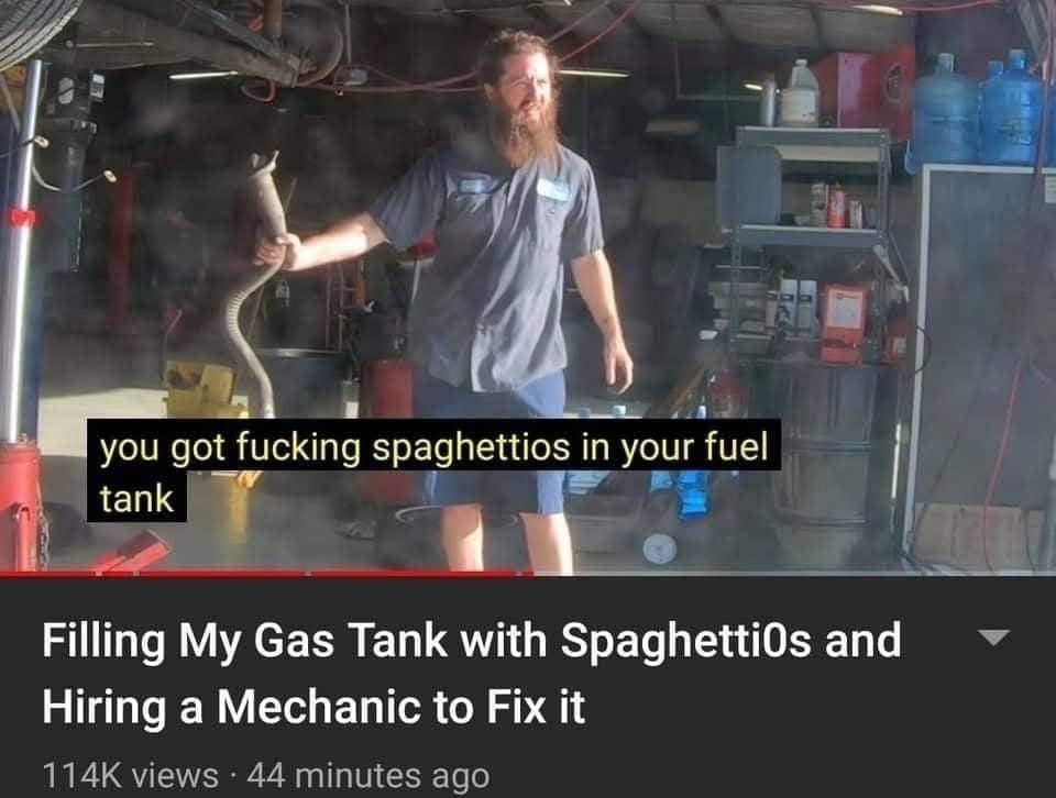 classic meme depicting a YouTube thumbnail where a physically exhausted mechanic holds an exhaust pipe. The video title reads, "Filling My Gas Tank with SpaghettiOs and Hiring a Mechanic to Fix it," with the mechanic captioned saying, "you got fucking spaghettios in your fuel tank."