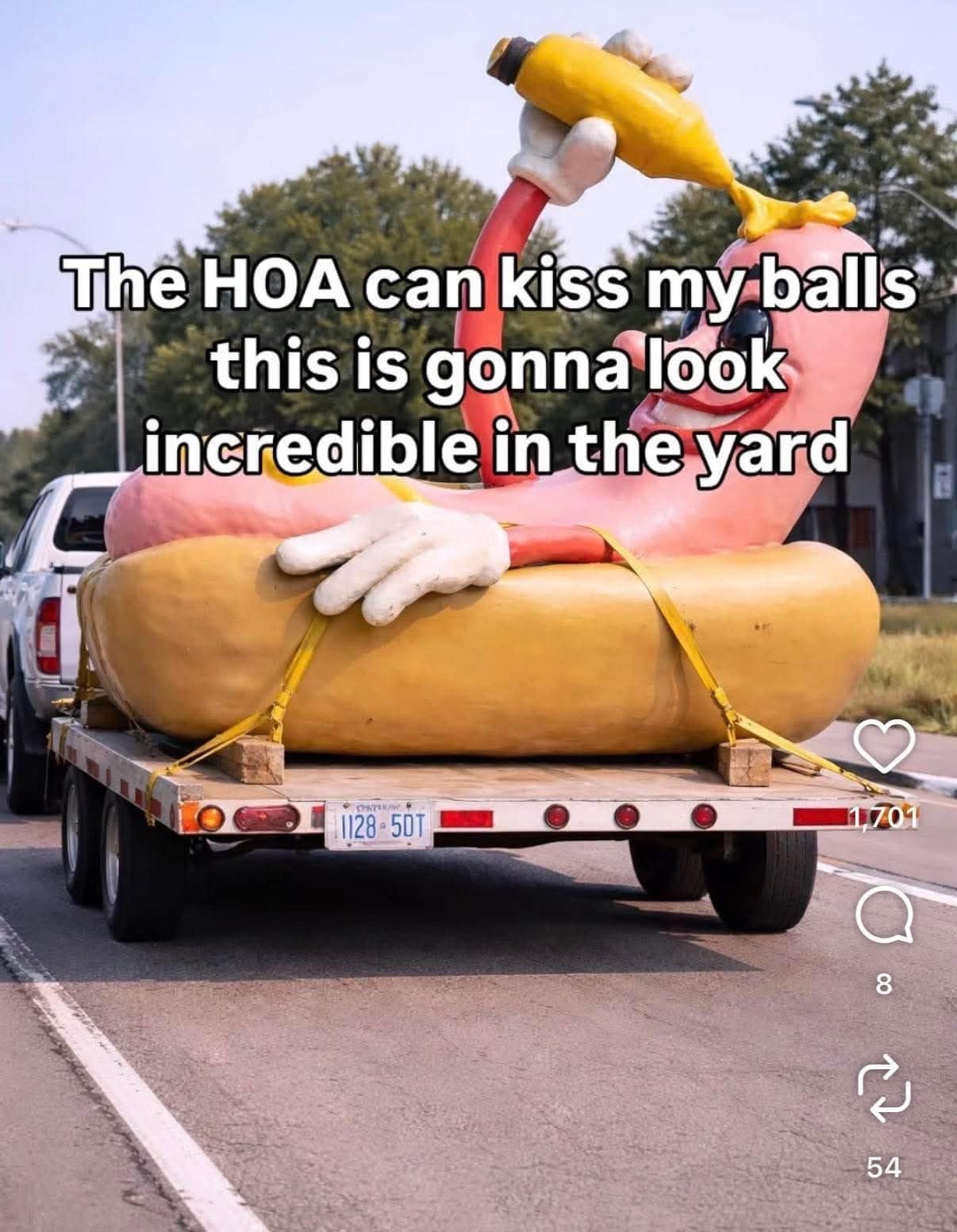 A hilarious classic meme featuring a giant, slightly disturbing statue of a hot dog putting mustard on itself strapped to a trailer, paired with a caption boldly declaring the HOA can kiss their b*lls because it will look incredible in the yard, a staple of anti-HOA old memes.