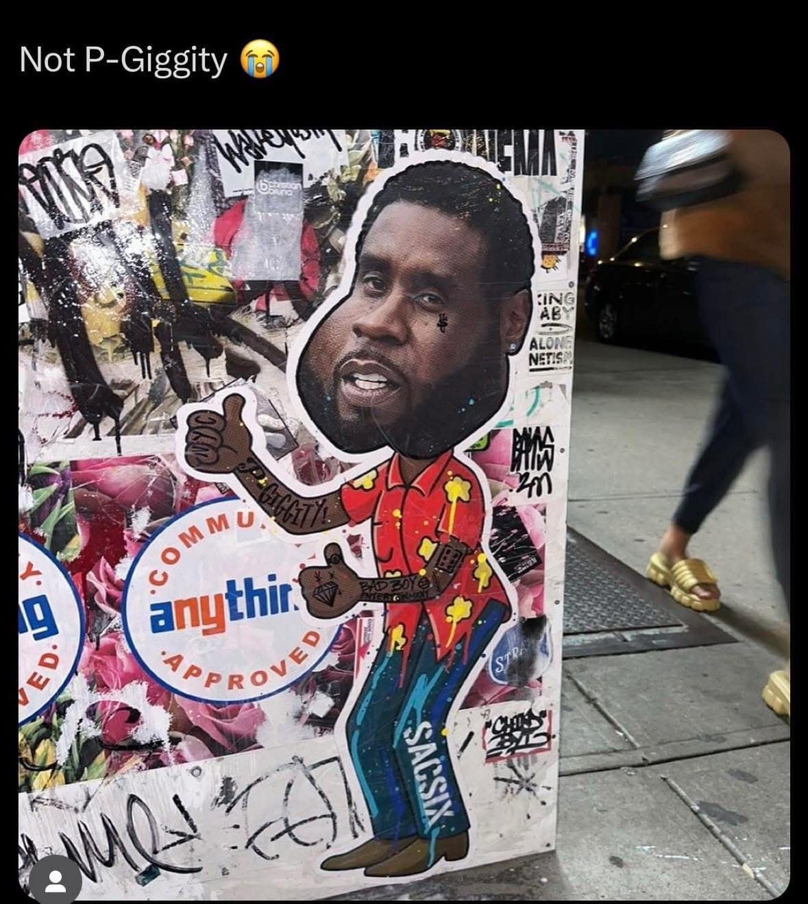 cursed classic meme showing a piece of New York City street art. It is a sticker of Sean "Diddy" Combs’ face distorted and photoshopped onto the body of Quagmire from Family Guy, complete with the signature "Giggity" jaw and red Hawaiian shirt. The caption reads: "Not P-Giggity 😭".