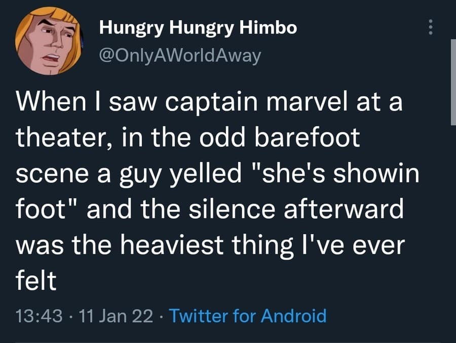 A text-based classic meme tweet from "Hungry Hungry Himbo." It describes a traumatic social experience at a screening of Captain Marvel where a man broke a tense silence during a barefoot scene by screaming "she's showin foot," making the subsequent silence "the heaviest thing I've ever felt."