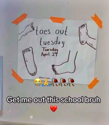 A "cursed" school environment classic meme. A photo shows a hand-drawn poster taped to a wall with orange tape that reads "toes out tuesday / Tuesday April 29th" alongside crude drawings of bare feet. Text at the bottom reads: "Get me out this school bruh."