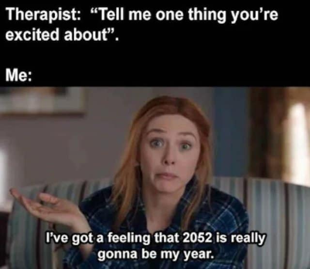 existential classic meme using Wanda Maximoff from the MCU. When asked by a therapist what she’s excited about, she shrugs and admits, "I’ve got a feeling that 2052 is really gonna be my year," capturing a vibe of extreme procrastination and long-term hope.