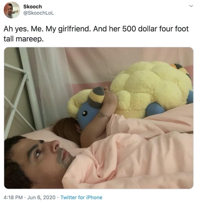 viral classic meme from Twitter user @SkoochLoL showing a man lying in bed looking deeply regretful as a massive, $500 four-foot-tall Mareep Pokémon plush occupies the space between him and his girlfriend.