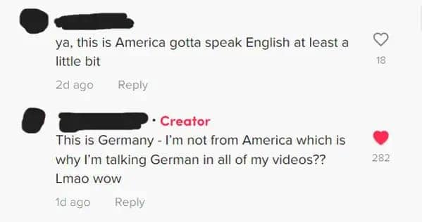 TikTok comment section where a user tells a German creator they must speak English in America.