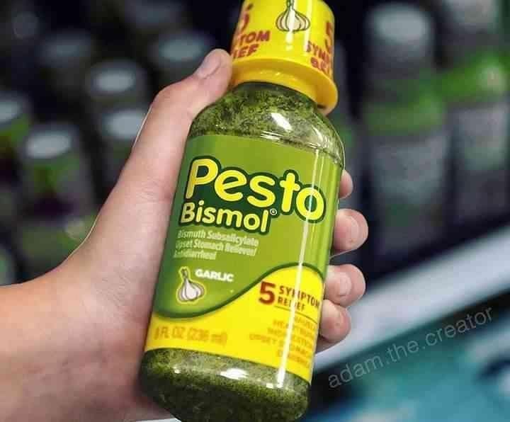 A hand holds a vibrant green bottle of "Pesto Bismol," a cursed food product mashup that replaces the standard pink bismuth subsalicylate with a chunky, garlic-flavored pasta sauce.