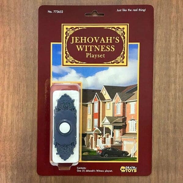minimalist funny fake action figure playset titled "JEHOVAH'S WITNESS Playset". Rather than a character, the "playset" consists solely of a single, ornate blue-and-white doorbell button mounted on the card.