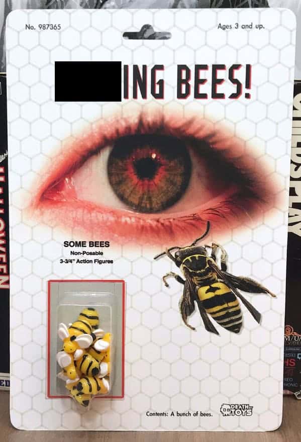 horrifying funny fake action figure set titled "STINGING BEES!" The card art displays a massive, bloodshot human eye, while the plastic bubble contains "a bunch of bees" in the form of small, non-posable yellow and black figurines.