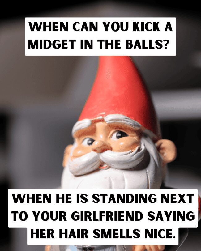 Close-up of a garden gnome with a joke about kicking someone in the balls.