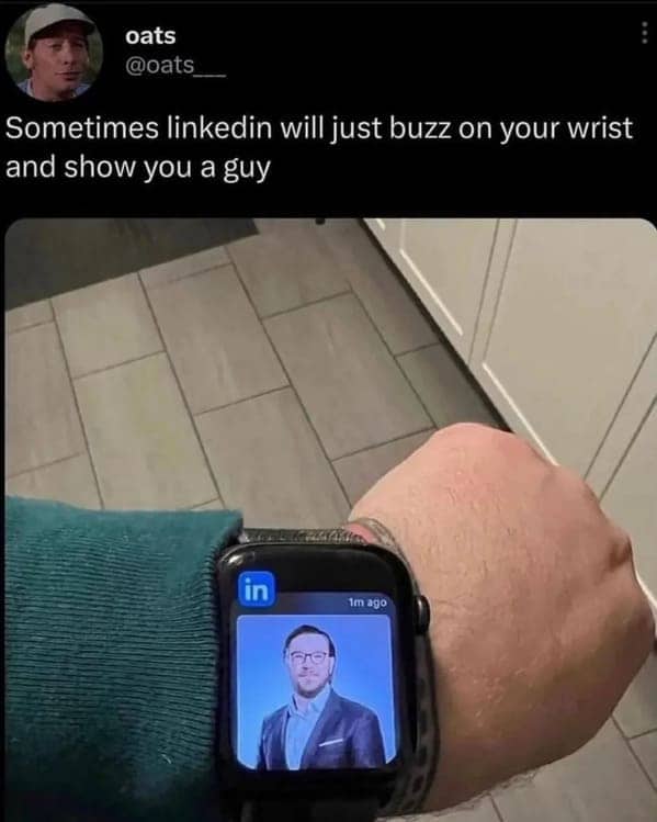 Smartwatch displaying a random LinkedIn profile notification while the user's wrist is being buzzed.