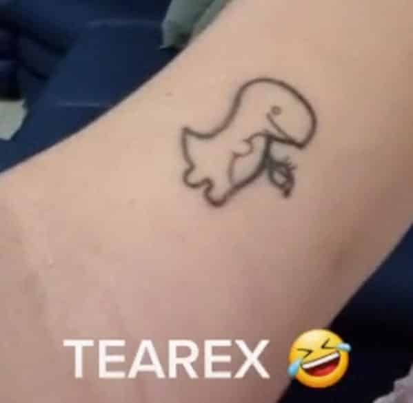 Simple line art tattoo of a dinosaur holding a teacup captioned as a Tearex.
