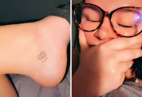 Woman laughing while revealing a small smiley face tattoo hidden on her inner ankle.