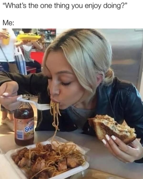 Woman aggressively shoveling Chinese takeout noodles into her mouth while holding a massive grilled sandwich. A highly relatable food meme about your favorite hobby.