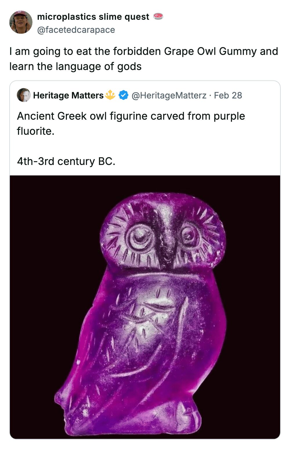 An ancient Greek purple fluorite owl figurine jokingly described as a forbidden grape gummy snack.