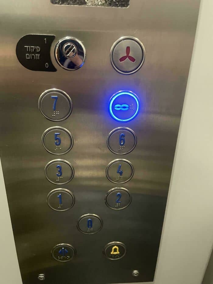 chaotic engineering funny fail inside an elevator. The button panel ignores all standard layouts, placing numbers in a non-sequential, V-shaped scattering that turns a simple floor selection into a puzzle.