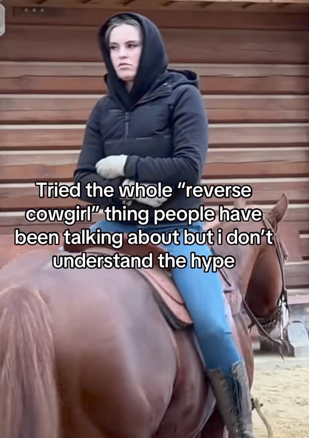 Woman sitting backward on a horse with a literal interpretation of the reverse cowgirl meme phrase.