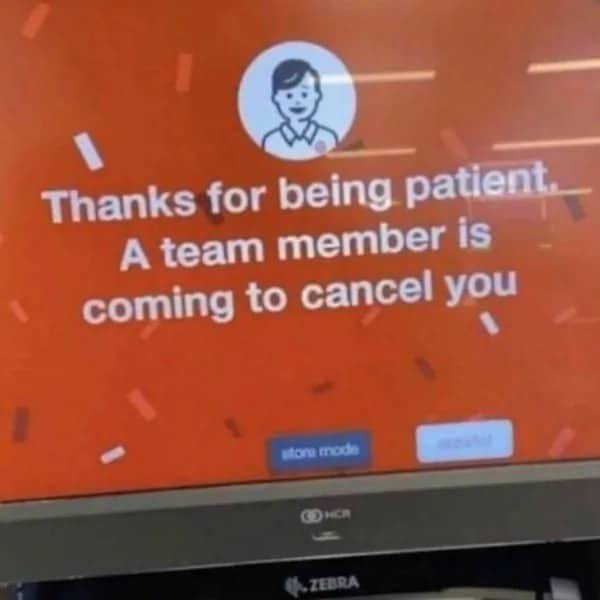 Error message on a self-checkout screen stating a team member is coming to cancel you.